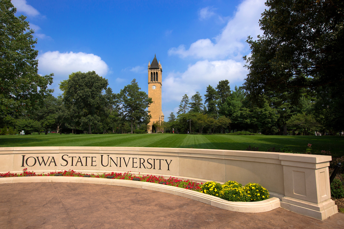 Iowa State University sign with campanile in the background