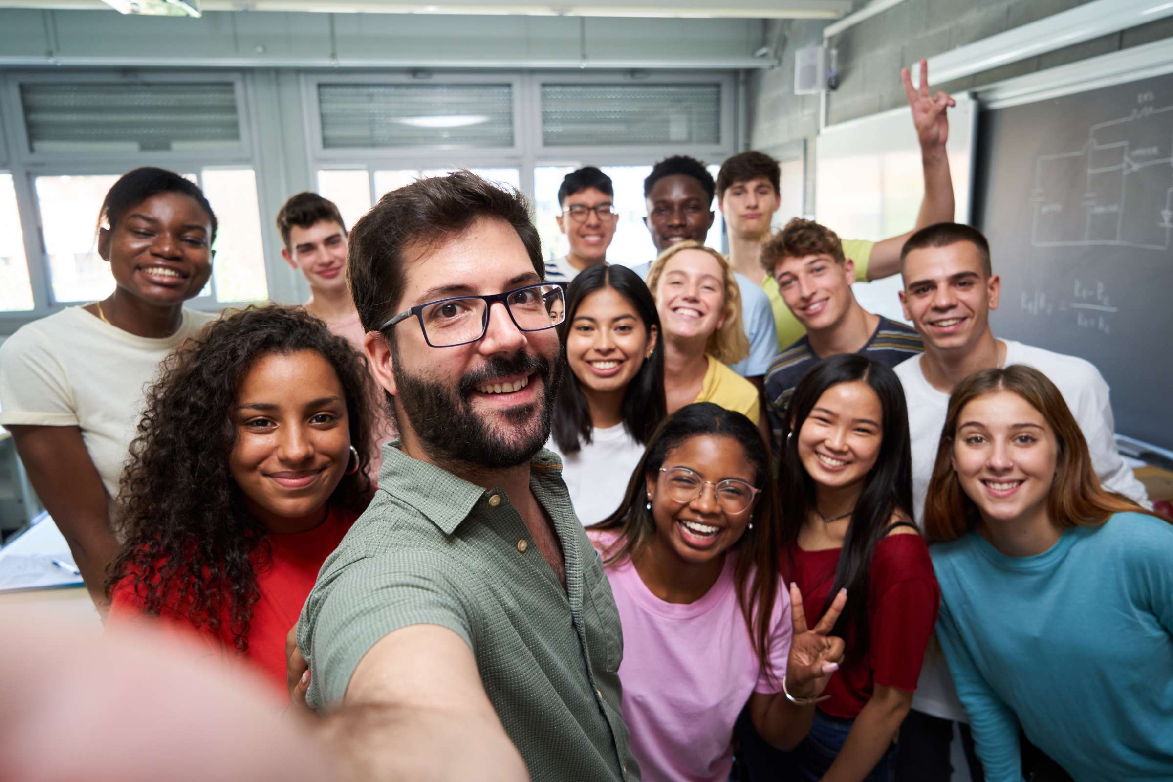 Selfie of many students and instructors smiling